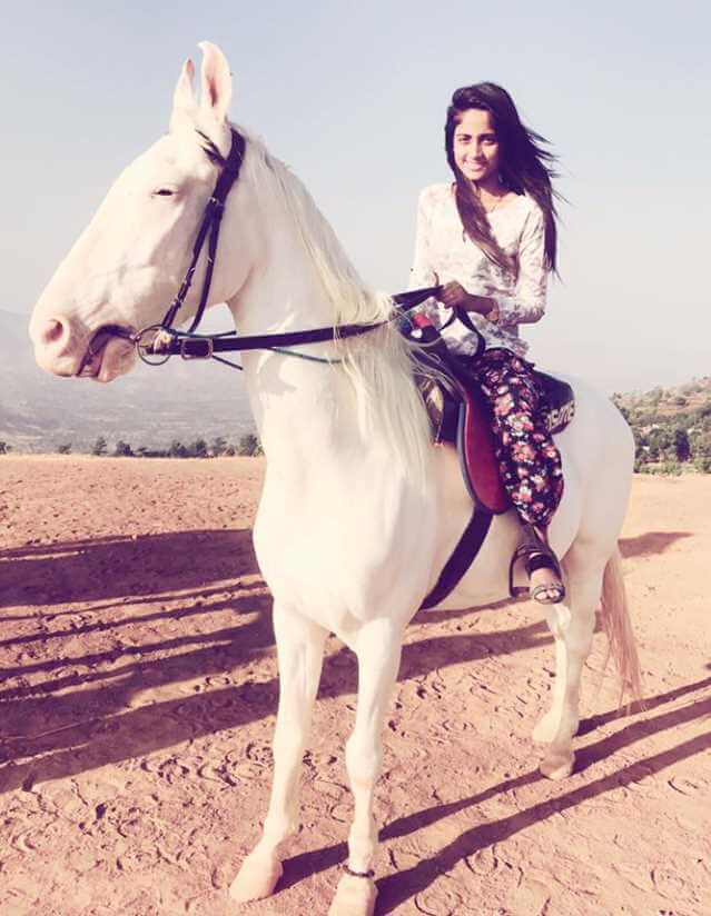 Nisha Guragain with Horse Image