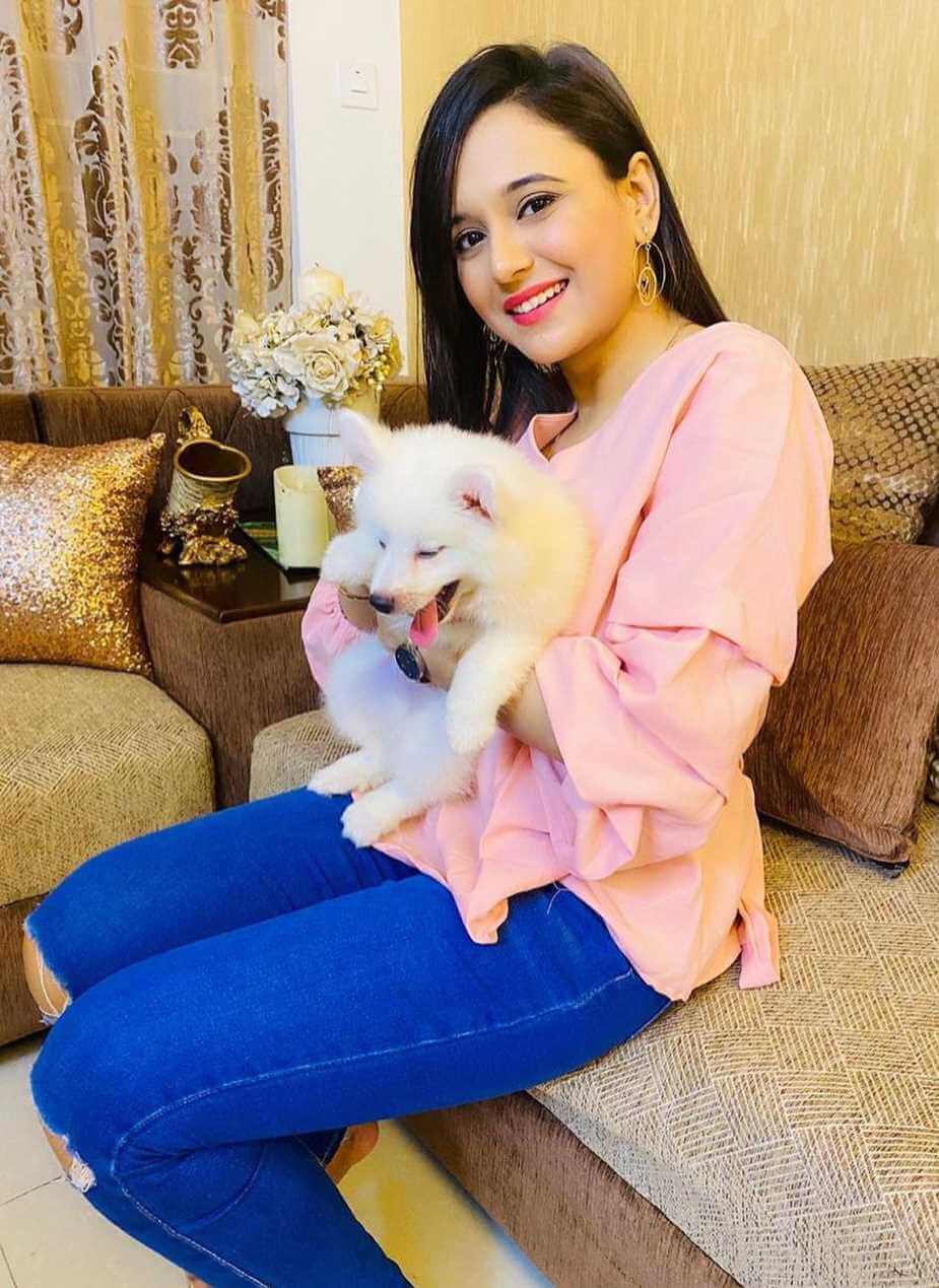 Sabila Nur with dog Image